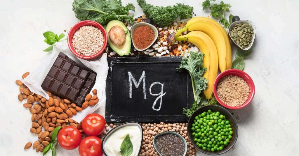 how does magnesium help with autism featured with a selection of magnesium-rich foods on white background