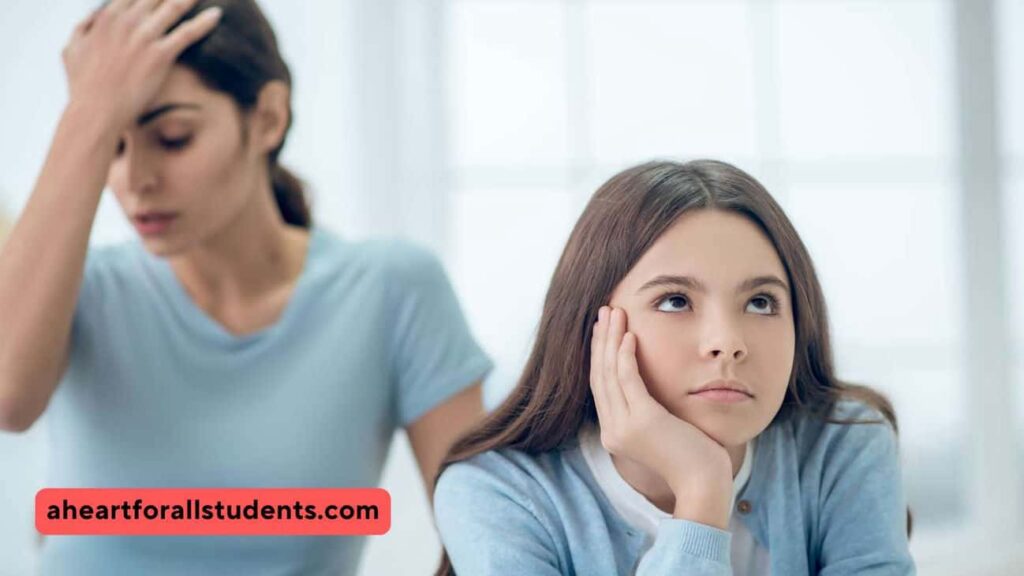 Mom and teen daughter. Daughter staring off into space with an attitude. Mom's hand is on her forehead in frustration.