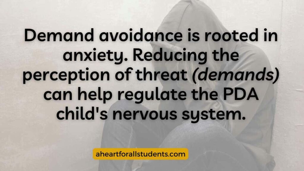 "Demand avoidance is rooted in anxiety. Reducing the perception of threat (demands) can help regulate the PDA child's nervous system." Teen boy in grey hoodie sitting on the floor hunched into a ball with head down.